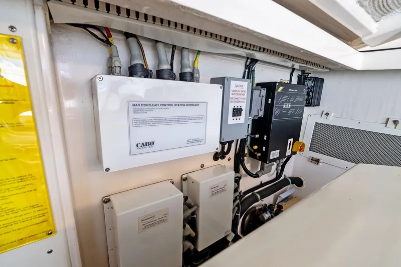 Pescador Yacht Photos Pics Engine room of 2004 Cabo 40 Hardtop Express with control panels and wiring.