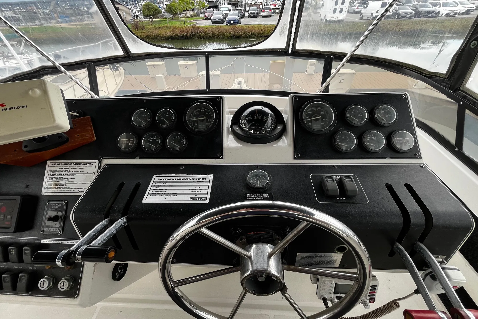 1991 Carver 33 Aft Cabin Motor Yacht helm with gauges and steering wheel.