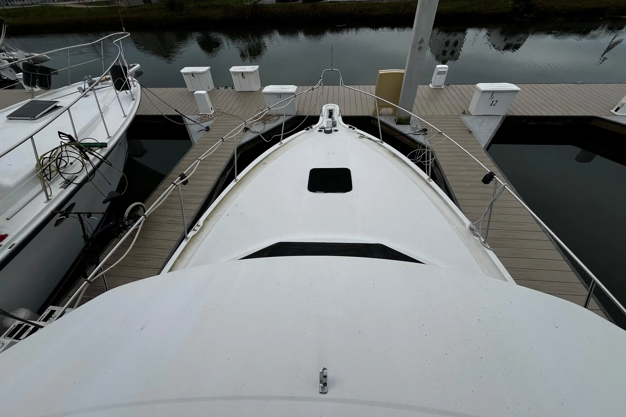 1991 Carver 33 Aft Cabin Motor Yacht docked at marina, top view.