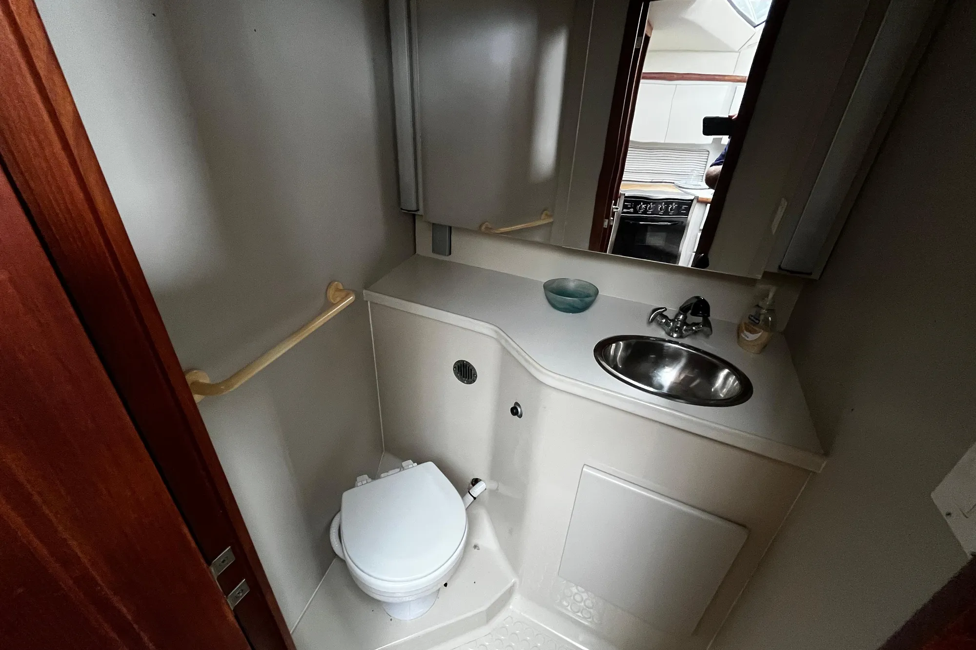 1991 Carver 33 Aft Cabin Motor Yacht bathroom with sink and toilet.