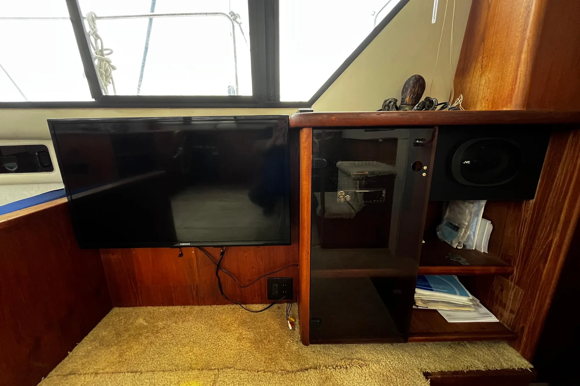 Interior of 1991 Carver 33 Aft Cabin Motor Yacht with TV and audio system.