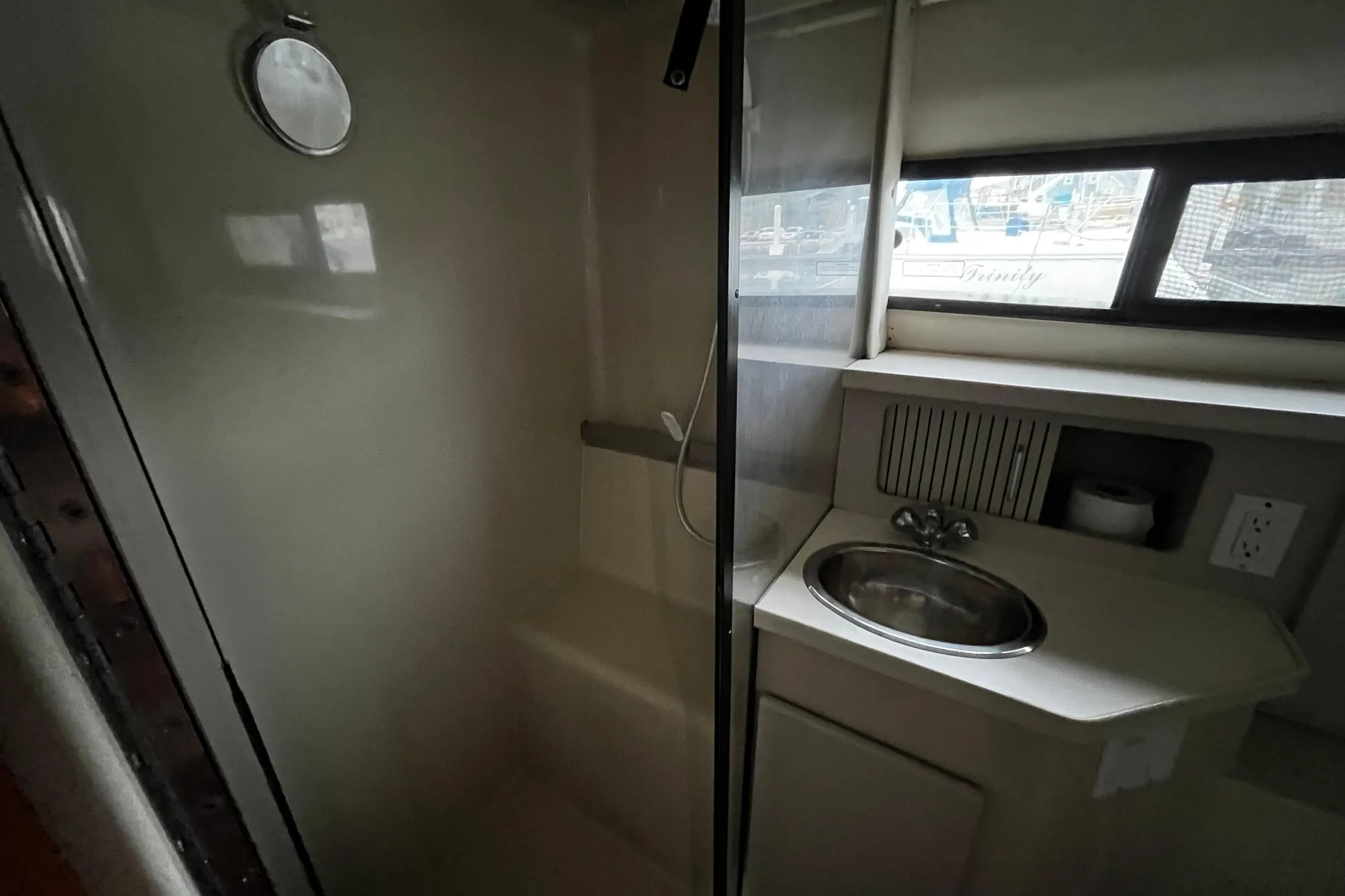 1991 Carver 33 Aft Cabin Motor Yacht bathroom with shower and sink.