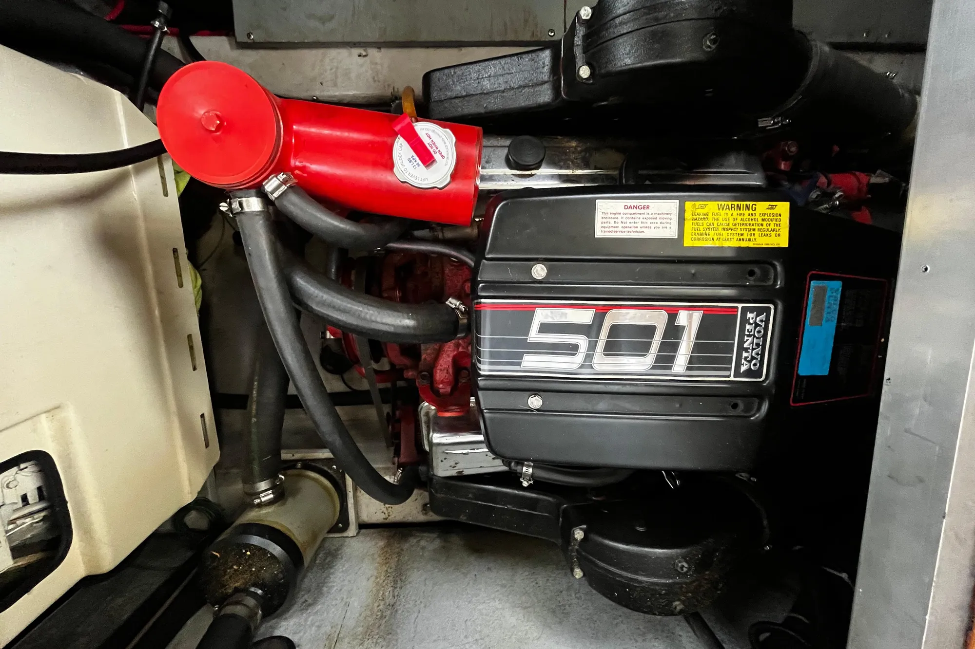 Engine compartment of a 1991 Carver 33 Aft Cabin Motor Yacht with Volvo Penta 501 engine.