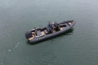 2022 Ribeye A811 boat cruising on calm water with two passengers onboard.