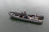 Ribeye A811 boat from 2022 on water, featuring sleek design and modern seating.