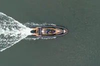 Top view of 2022 Ribeye A811 boat cruising on water, leaving a wake.