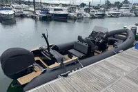 Ribeye A811 boat docked at marina, 2022 model, sleek design with modern seating.