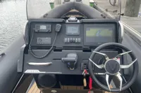 Control panel of a 2022 Ribeye A811 boat with navigation and communication equipment.