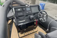 Cockpit of 2022 Ribeye A811 boat with modern controls and steering wheel.