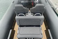 Ribeye A811 boat interior with diamond-stitched seating, cup holders, and steering wheel, 2022 model.