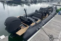 Ribeye A811 boat, 2022 model, docked at marina with "WHY KNOT" nameplate.
