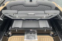 Ribeye A811 2022 boat storage compartment with open lid, showcasing interior space.