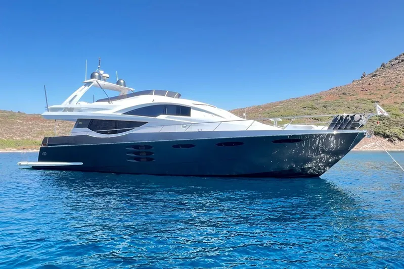  Yacht Photos Pics Luxurious 2010 Numarine 78 yacht anchored in clear blue waters.