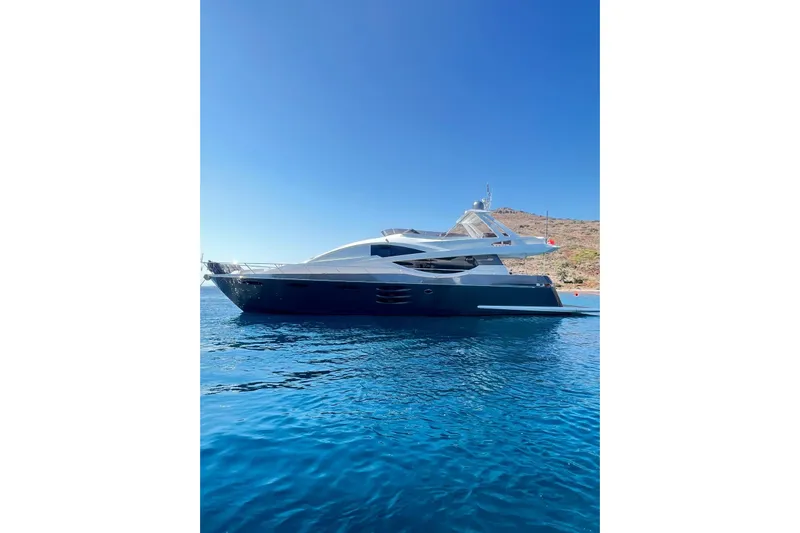  Yacht Photos Pics Luxury 2010 Numarine 78 yacht on clear blue water, sunny day.