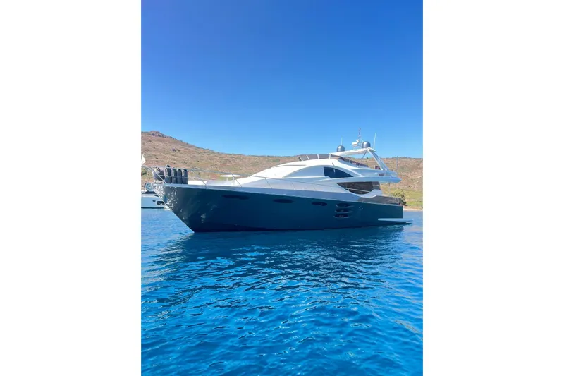  Yacht Photos Pics Luxury 2010 Numarine 78 yacht on clear blue water, under a bright sky.