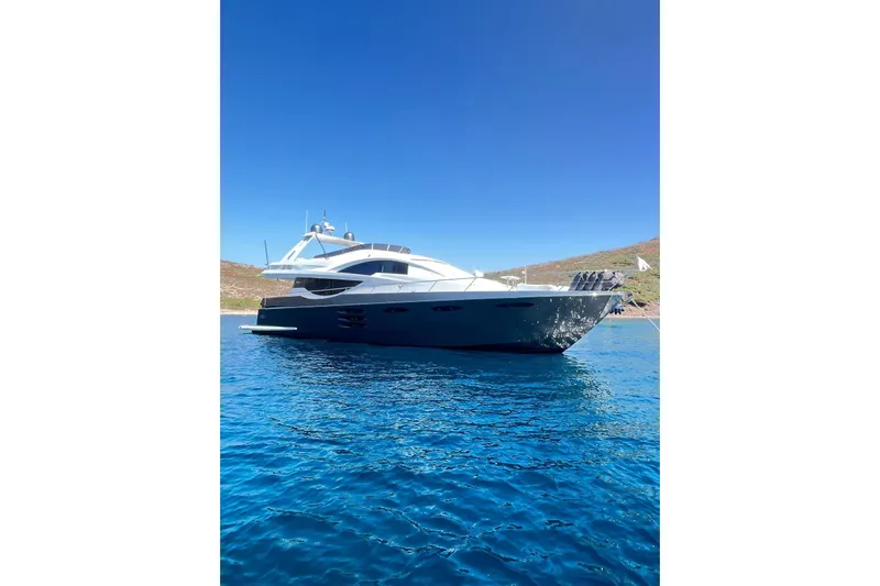  Yacht Photos Pics Luxurious 2010 Numarine 78 yacht on clear blue water under a bright sky.