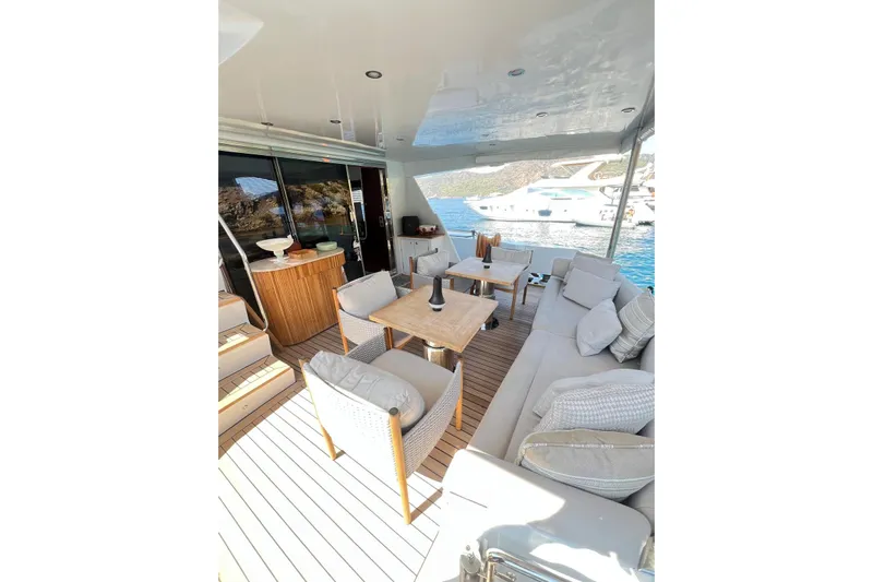  Yacht Photos Pics Luxurious 2010 Numarine 78 yacht deck with elegant seating and scenic ocean view.