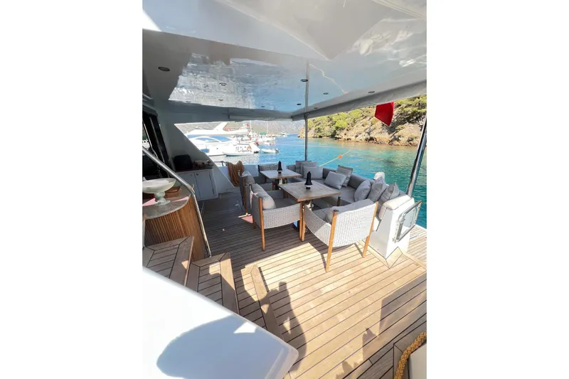  Yacht Photos Pics Luxurious 2010 Numarine 78 yacht deck with elegant seating and scenic ocean view.