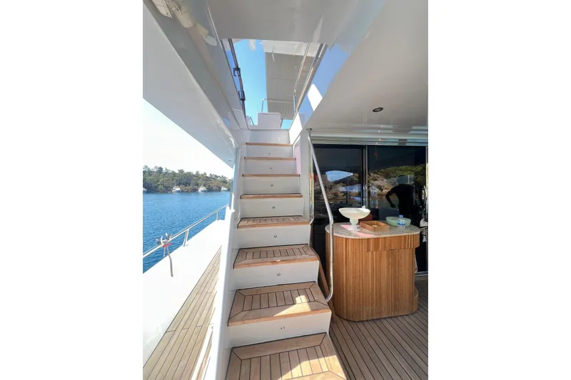  Yacht Photos Pics Staircase on 2010 Numarine 78 yacht with wooden deck and scenic ocean view.