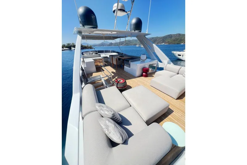  Yacht Photos Pics Luxurious 2010 Numarine 78 yacht deck with modern seating, overlooking serene blue waters.