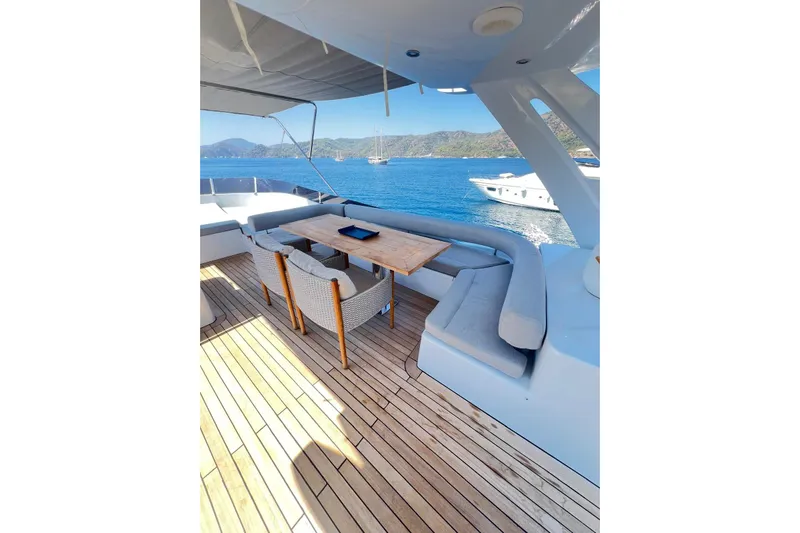  Yacht Photos Pics Luxury Numarine 78 yacht deck with seating, table, and scenic ocean view, 2010 model.