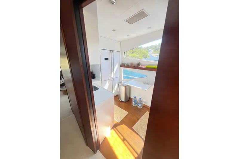  Yacht Photos Pics Modern kitchen interior on 2010 Numarine 78 yacht, featuring sleek design and natural light.