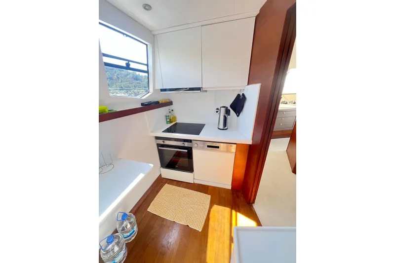  Yacht Photos Pics Compact kitchen in 2010 Numarine 78 yacht, featuring modern appliances and sleek design.