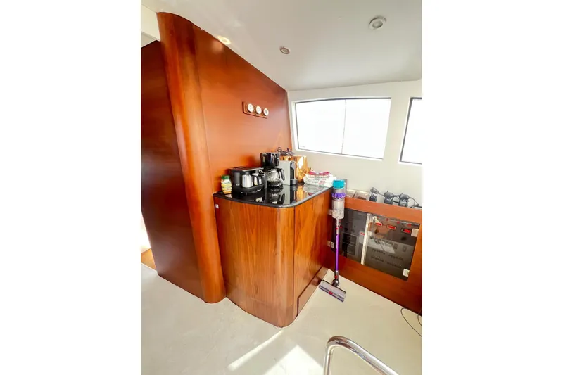  Yacht Photos Pics Interior of 2010 Numarine 78 yacht with wooden cabinetry and modern appliances.