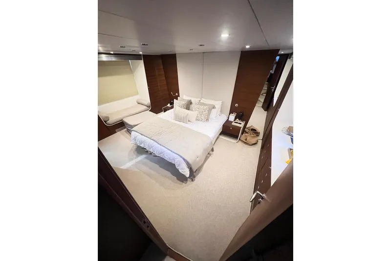  Yacht Photos Pics Luxurious bedroom interior on 2010 Numarine 78 yacht, featuring modern design and cozy bedding.