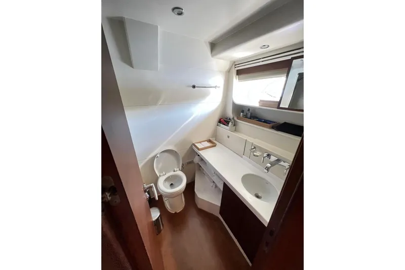  Yacht Photos Pics Bathroom interior of 2010 Numarine 78 yacht, featuring modern fixtures and ample lighting.