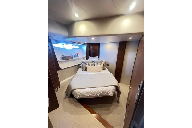  Yacht Photos Pics Luxurious bedroom interior of 2010 Numarine 78 yacht with modern decor and ambient lighting.