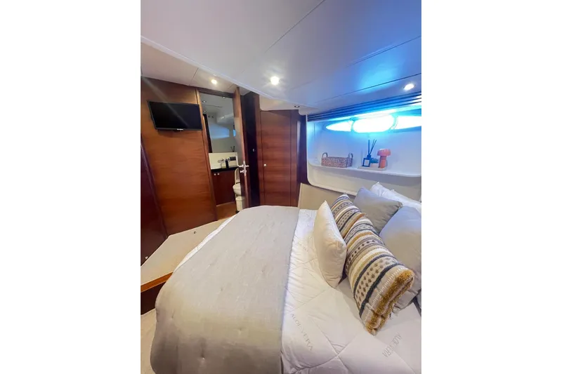  Yacht Photos Pics Luxurious bedroom interior of 2010 Numarine 78 yacht with modern decor and ambient lighting.