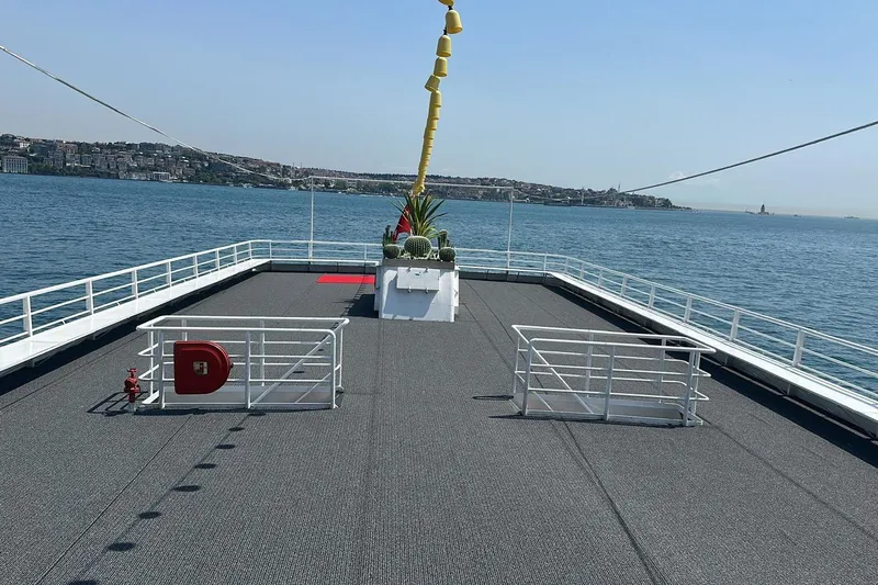  Yacht Photos Pics Deck view of 2012 Turkish Boat Yard 49m yacht, overlooking calm sea and distant shoreline.