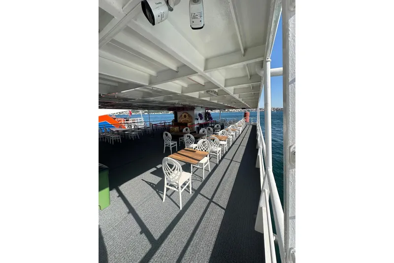  Yacht Photos Pics Spacious deck of 2012 Turkish Boat Yard 49m yacht with seating, overlooking the sea.