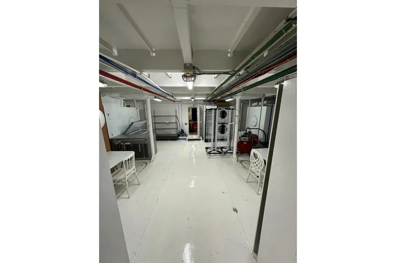  Yacht Photos Pics Engine room of a 2012 Turkish Boat Yard 49m yacht, featuring equipment and seating.