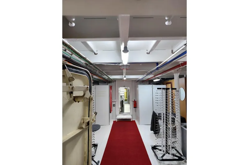  Yacht Photos Pics Interior of a 2012 Turkish Boat Yard 49m yacht, featuring a red carpeted corridor.