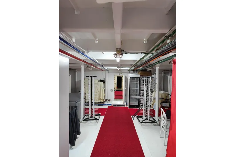  Yacht Photos Pics Interior of a 2012 Turkish Boat Yard 49m yacht with red carpet and storage racks.