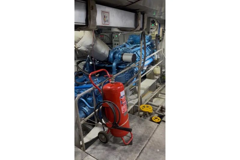  Yacht Photos Pics Engine room of 2012 Turkish Boat Yard 49m yacht with fire extinguisher and machinery.