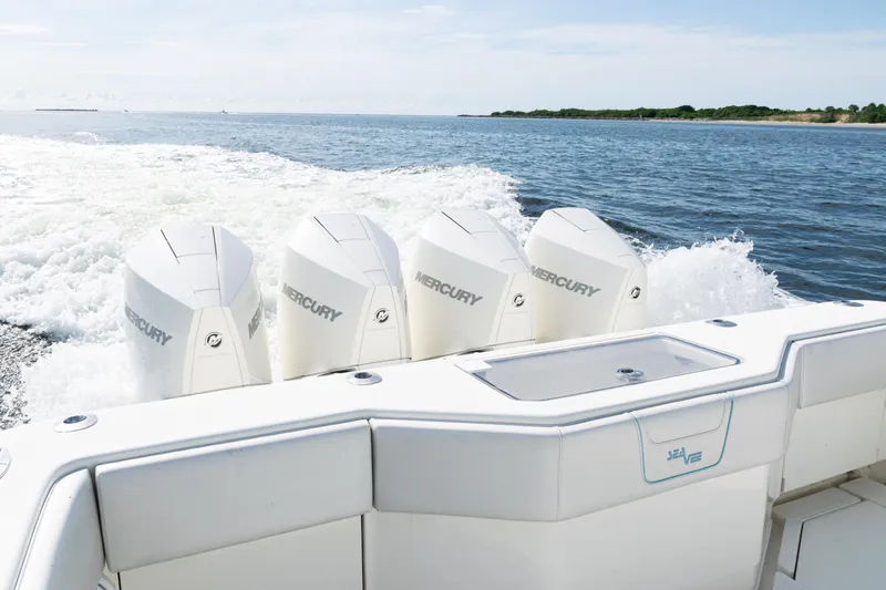  Yacht Photos Pics 2021 SeaVee 390 boat with four Mercury engines cruising on open water.
