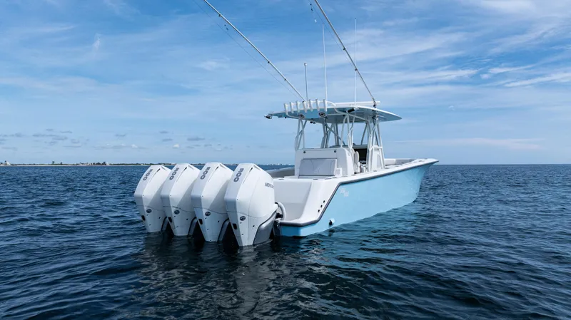  Yacht Photos Pics 2021 SeaVee 390 boat with four outboard engines on open water.