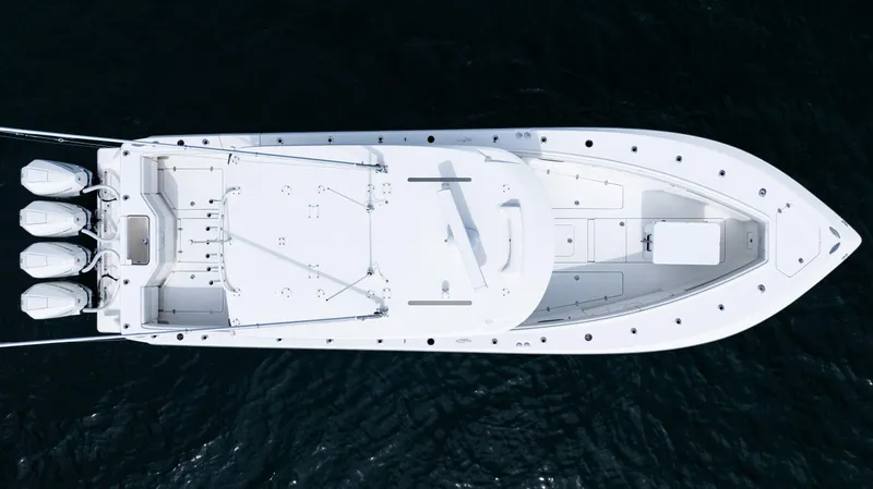  Yacht Photos Pics Top view of 2021 SeaVee 390 boat with triple outboard engines on water.
