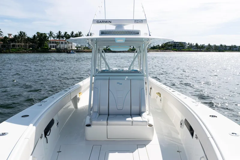  Yacht Photos Pics 2021 SeaVee 390 boat on water, featuring sleek design and advanced Garmin navigation system.