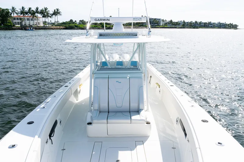  Yacht Photos Pics 2021 SeaVee 390 boat on water, featuring Garmin equipment, with scenic coastal background.