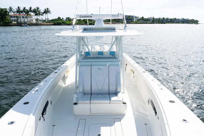  Yacht Photos Pics 2021 SeaVee 390 boat on water, featuring Garmin equipment, with coastal background.