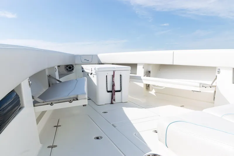  Yacht Photos Pics 2021 SeaVee 390 boat interior with seating and storage compartments.