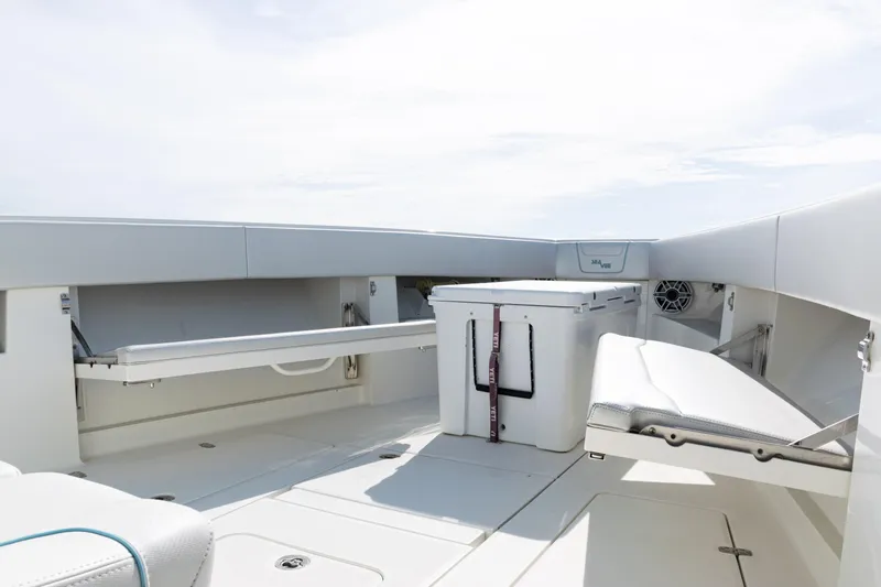  Yacht Photos Pics 2021 SeaVee 390 boat interior with seating and storage compartments.