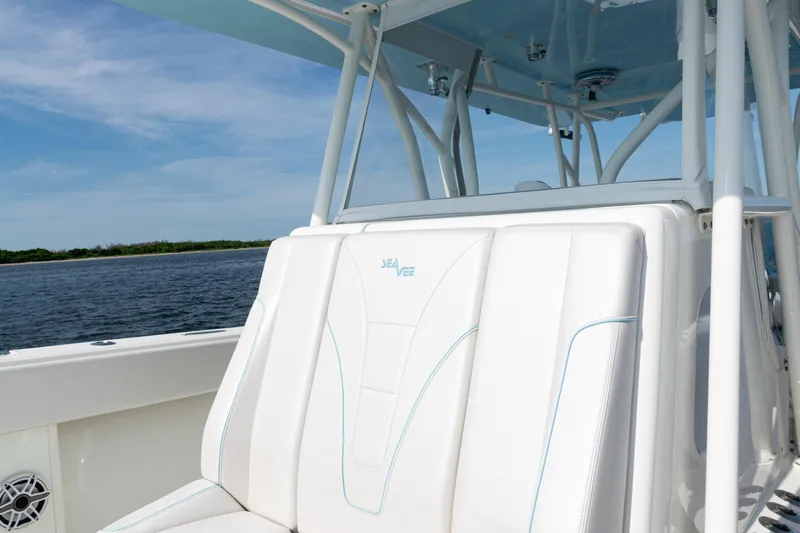  Yacht Photos Pics 2021 SeaVee 390 boat with white seating, ocean view, and clear blue sky.