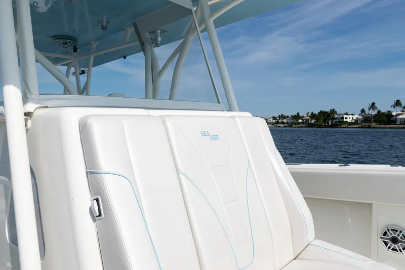  Yacht Photos Pics 2021 SeaVee 390 boat seat with ocean view and coastal background.