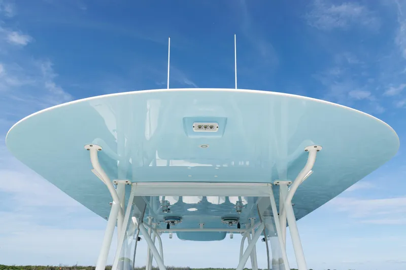 Yacht Photos Pics 2021 SeaVee 390 boat's sleek blue canopy against a clear sky.