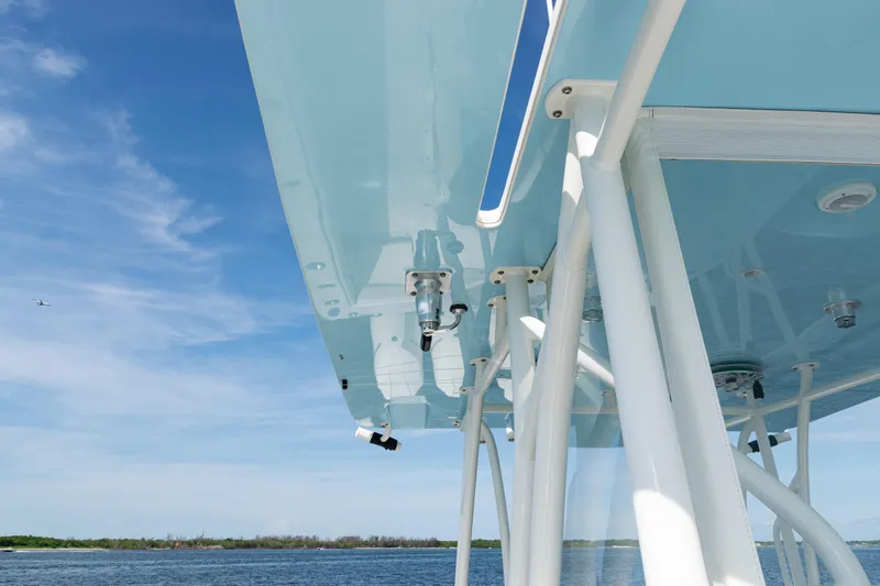  Yacht Photos Pics 2021 SeaVee 390 boat canopy with blue sky and ocean background.